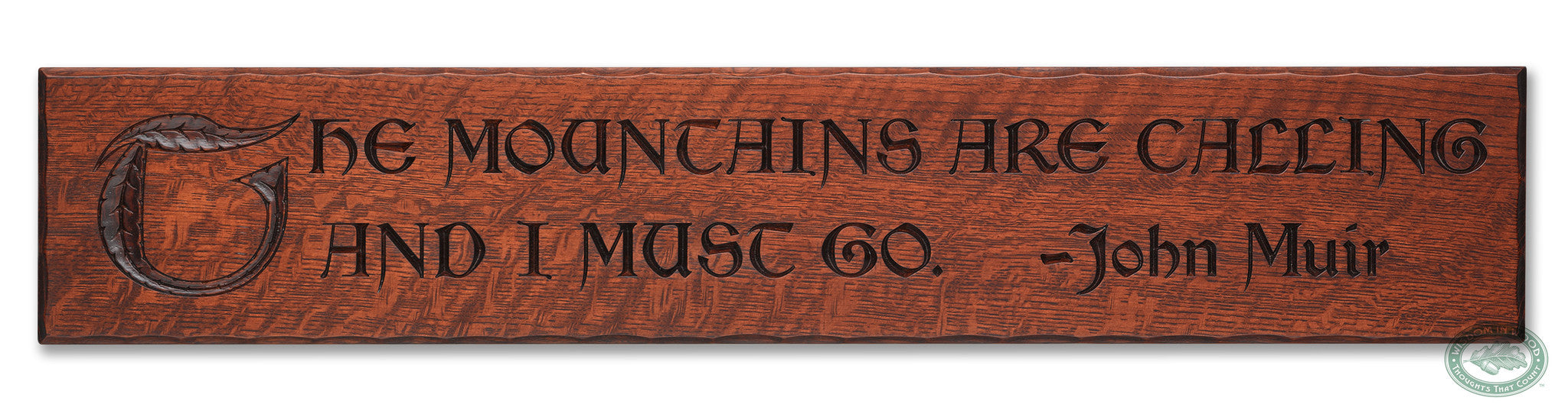John Muir Quote: "The mountains are calling and I must go." beautifully carved as a Wisdom In Wood® inspirational wall art saying.- Heritage Oak Finish