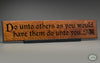 The Golden Rule: “Do unto others as you would have them do unto you.” beautifully carved as a Wisdom In Wood® inspirational wall art saying.- Classic Oak Finish