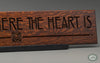 "Home is Where the Heart Is" quote beautifully carved as a Wisdom In Wood® inspirational wall art saying.- Heritage Oak Finish