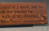 Robert Frost Quote: “Two roads diverged in a wood, and I-- I took the one less traveled by, And that has made all the difference.” beautifully carved as a Wisdom In Wood® inspirational wall art saying.- Classic Oak Finish